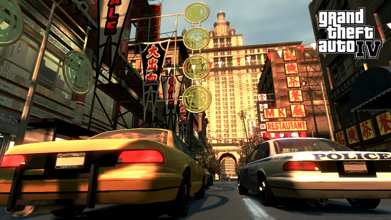 Cars race along a Liberty City avenue under illuminated signs in GTA IV